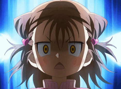 a close up of a girl 's face with a very angry look on her face