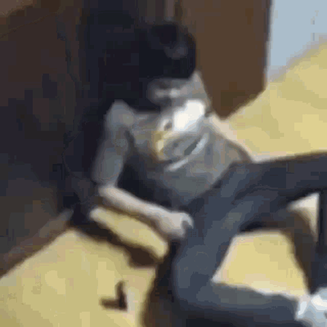 a person is laying on the floor in a room with a bottle of beer .