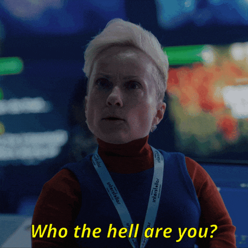 a woman with a lanyard that says " who the hell are you " on it