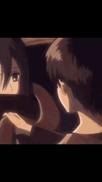 a man and a girl are looking at each other in a dark room