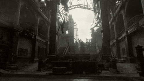 a black and white photo of a ruined building with columns