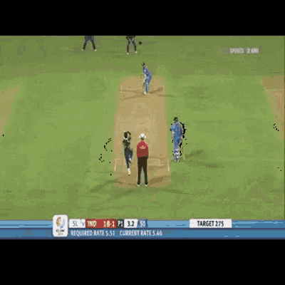 a cricket game is being played on a field with a pepsi ad in the background