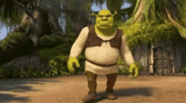shrek from the movie shrek is walking down a dirt road .