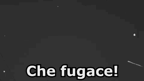 a black and white photo of a shooting star in the night sky with the words `` che fugace '' written below it .