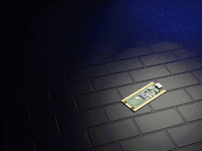 a small electronic device is laying on a dark brick floor
