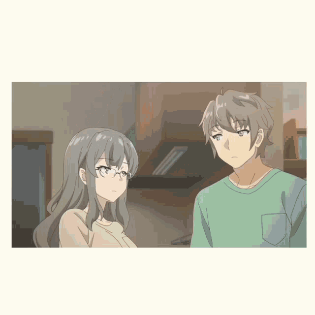 a boy and a girl are standing next to each other in a kitchen