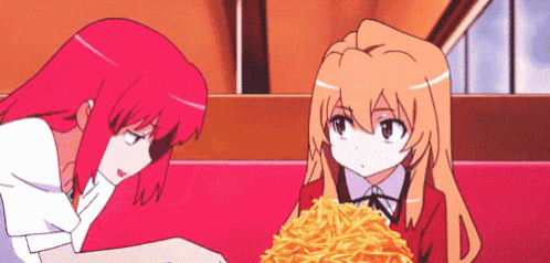 two anime girls are eating french fries together