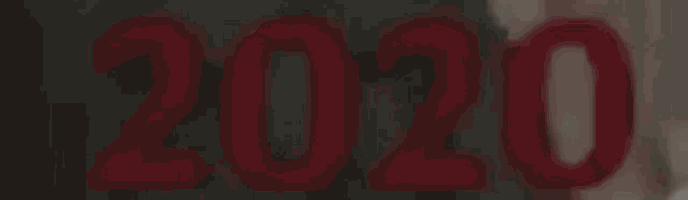 a close up of the number 2020 on a dark background .