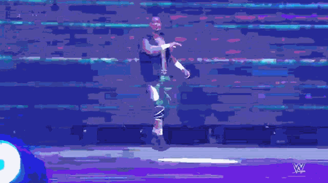 a pixelated image of a person dancing with a blue background