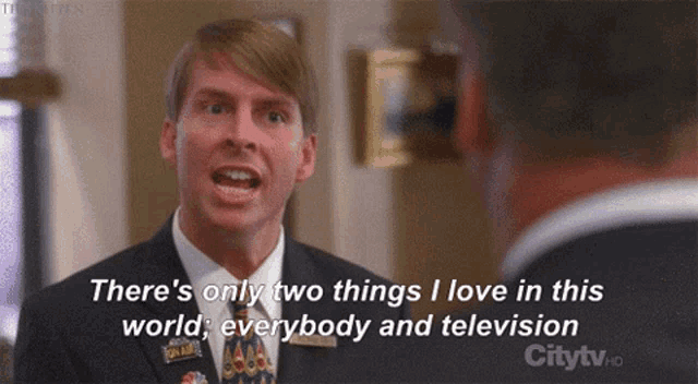 a man in a suit and tie says there are only two things i love in this world everybody and television
