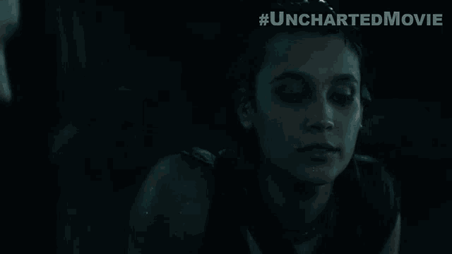 a woman in a dark room with the words thank you in front of her