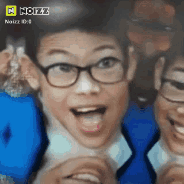 a blurred image of a person with glasses and a noizz logo