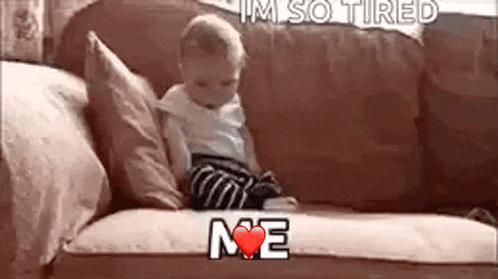 a baby is sitting on a couch with the words `` i 'm so tired me '' written on it .