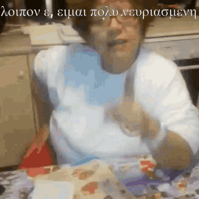 a woman is sitting at a table with a knife in her hand and a foreign language written on the bottom of the image