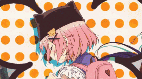 a girl with pink hair wearing a cat hat