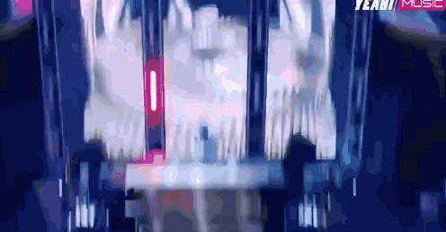 a blurry picture of a stage with the words yeah music on the bottom right