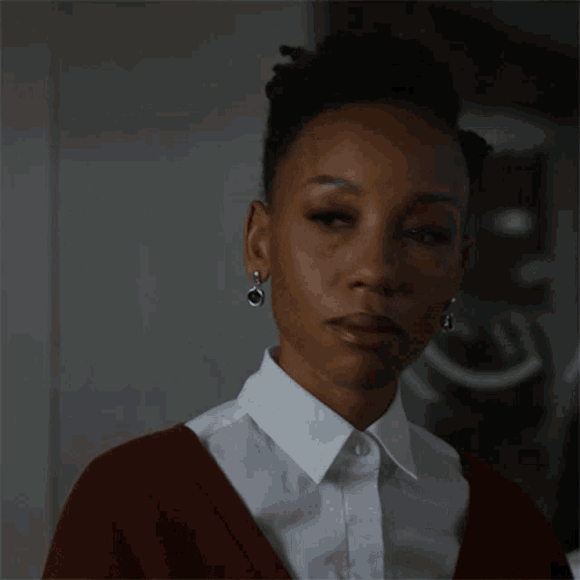 a woman says " i 'm staying here " while wearing a red sweater