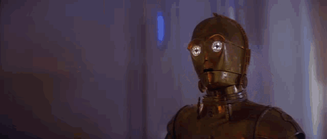 two robots standing next to each other in a room