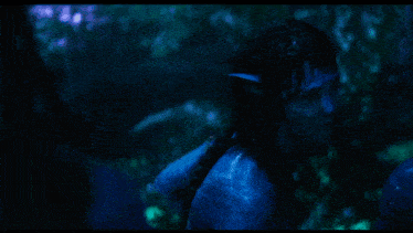 a person with blue paint on their face and ears