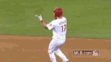 a phillies baseball player is giving the thumbs up