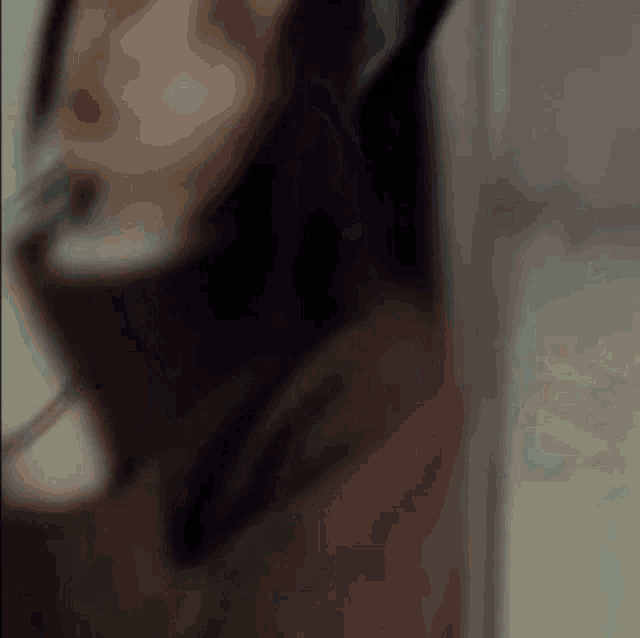 a blurry picture of a woman 's face with a turtleneck