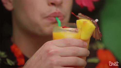 Sipping Tropical Drink GIF - Sipping Tropical Drink Relaxing GIFs