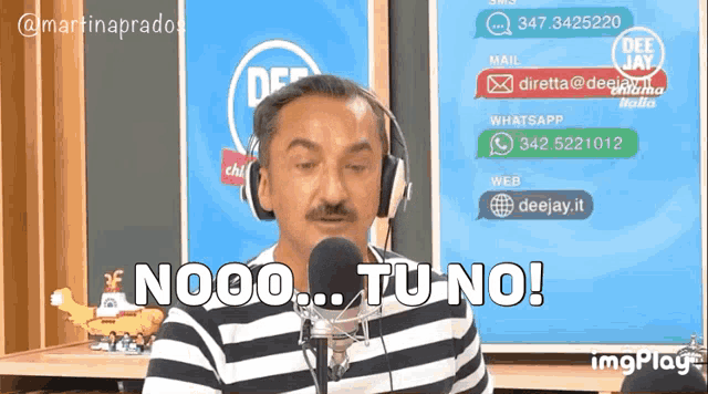 a man wearing headphones is talking into a microphone and says " nooo tu no "