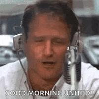 a man wearing headphones is talking into a microphone and says `` good morning united '' .