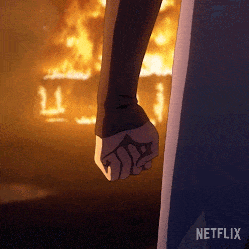 a person 's fist is shown in front of a fire and the word netflix is visible