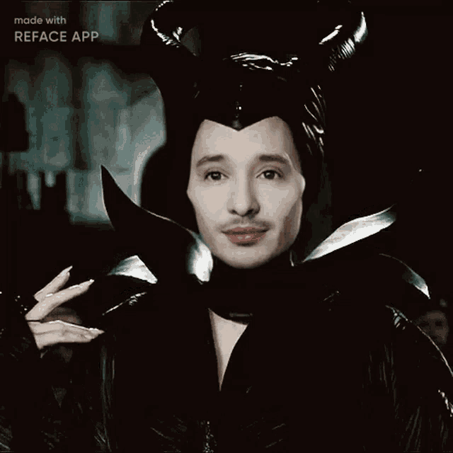 a man in a maleficent costume is smiling with the words made with reface app above him