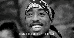 a black and white photo of a man wearing a bandana and smiling with the words `` biggie close but no cigar '' .