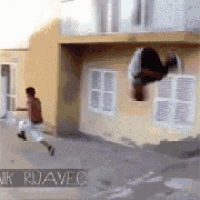 a man is doing a trick in front of a building with the word ruavec on the bottom