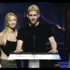a man and a woman are standing at a podium with a sign that says ' united states of america ' on it