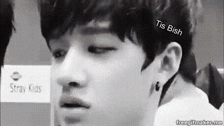 a black and white photo of a young man 's face with the words tis ish above it