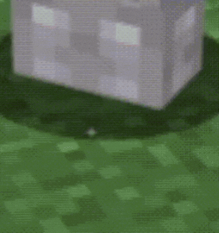 a white minecraft block is sitting on top of a green field .