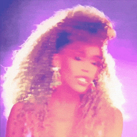 a woman with long curly hair is wearing earrings and a purple background .