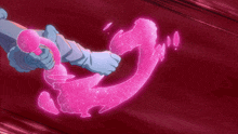 a person holding a pink object in their hands