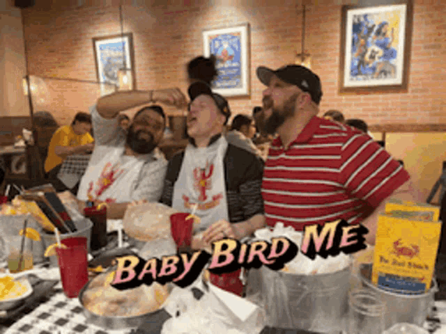 a group of men are sitting at a table with baby bird me written on the bottom