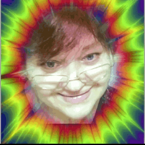 a woman 's face is surrounded by a rainbow colored background