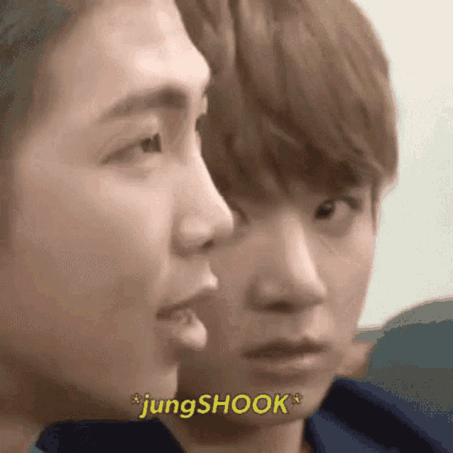 a close up of two young men 's faces with the words jungshook written above them .