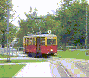 a red and yellow train with the number 1 on the top of it