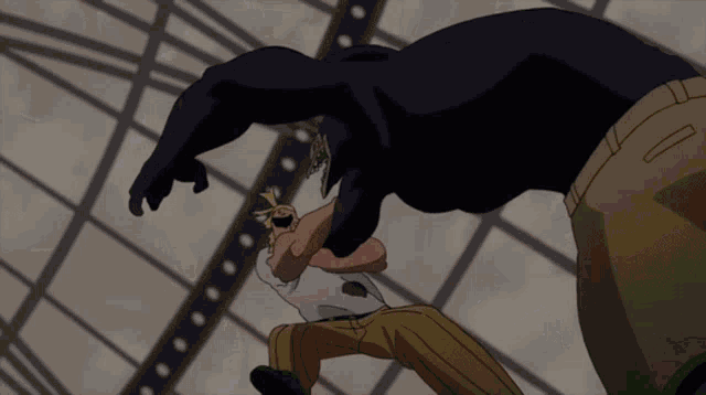 a man in a black suit is being thrown in the air