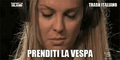 a woman wearing headphones says " prenditi la vespa " in a foreign language