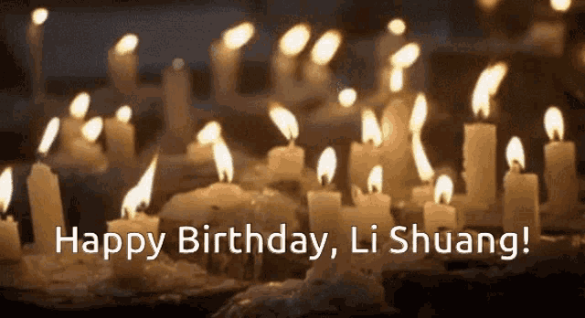 a bunch of lit candles with the words happy birthday li shuang on the bottom