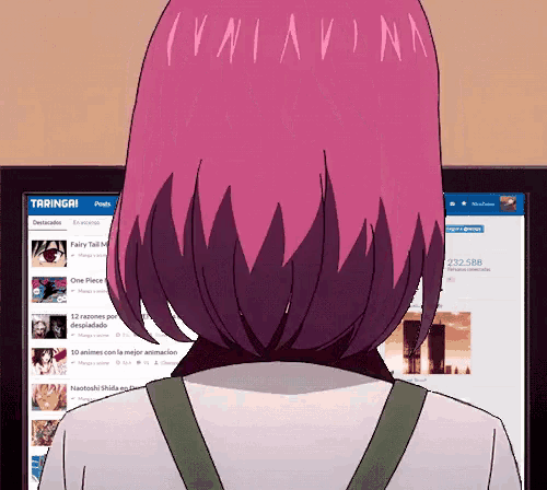 a girl with pink hair is standing in front of a computer screen that says taringa