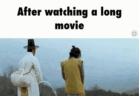 a couple of men standing next to each other with the words after watching a long movie on the bottom