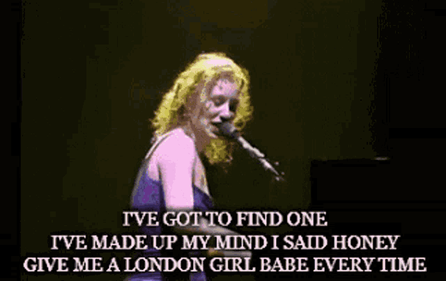 a woman singing into a microphone with the words i 've got to find one on the bottom