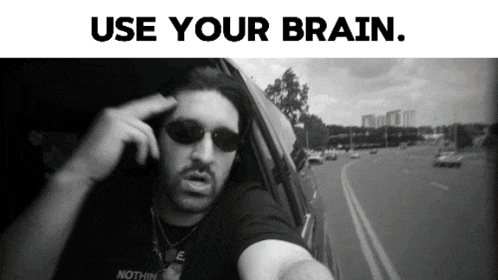 a black and white photo of a man in a car with the words use your brain below him