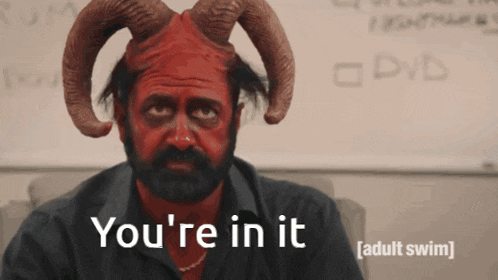 a man with horns and red paint on his face says " you 're in it "