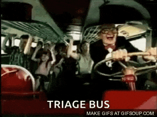 a man in a tuxedo is driving a bus with a crowd of people on it .